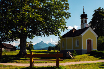 Little chapel with mountains in the background