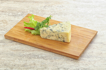Blue cheese piece over board