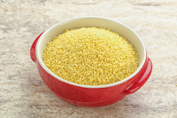 Raw couscous in the bowl