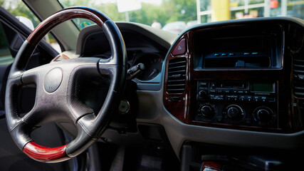 Car steering wheel and music box. Modern car interrior.