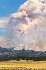 Large cloud of smoke from forest fires. Wildfire season in Utah.