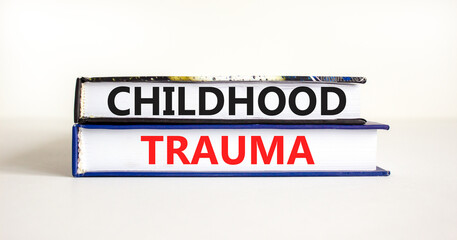 Childhood trauma symbol. Concept words Childhood trauma on beautiful books. Beautiful white table white background. Business psychology childhood trauma concept. Copy space.