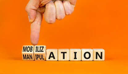 Mobilization or manipulation symbol. Concept words Mobilization Manipulation on wooden cubes....