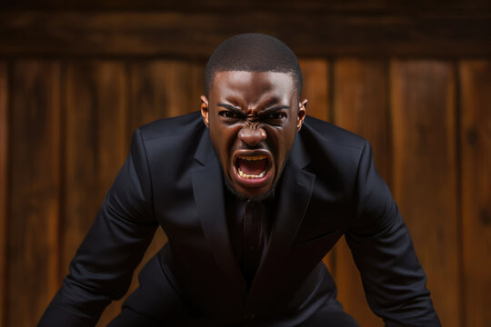 Anger African Man In Black Suit On Wooden Plank Background. Сoncept Anger, African Representation, Suit Styles, Wood Textures