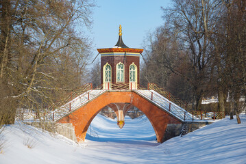 View of the ancient Cross Bridge on a sunny February day. Alexander Park in Tsarskoye Selo....