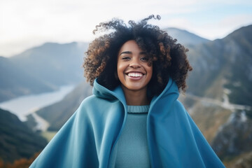 Surprise African Girl In Blue Coat On Mountain Scenery Background. Сoncept African Girl In Blue Coat, Mountain Scenery Background, Surprising Moments, Childhood Memories