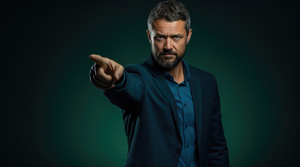 Fototapeta premium Middle aged man wearing casual clothes pointing with hand and finger to the side looking at the camera.