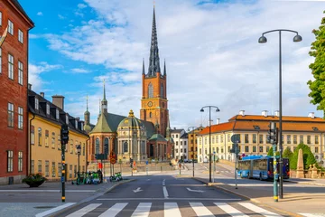 Foto op Aluminium The imposing facade and spire of the Riddarholmen Church, the church of the former medieval Greyfriars Monastery, on a sunny summer morning in Stockholm, Sweden.  © Kirk Fisher
