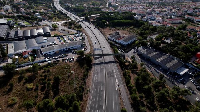 Aerial drone POV reveal of A5 highway in Cascais, Portugal looking east towards Lisbon