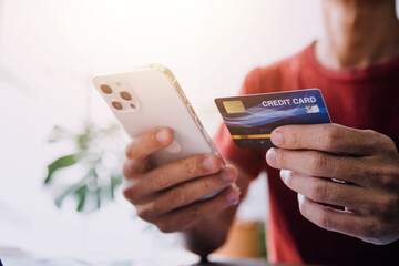 Businesswoman hands holding cradit card and using credit card online shopping. Online shopping concept