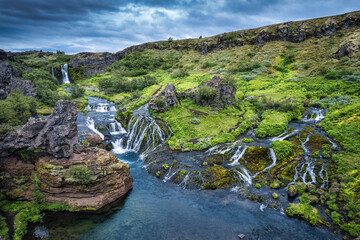 Gjain waterfall flowing in Pjorsardalur lush valley during summer at Iceland © Mumemories