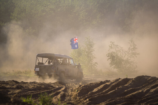 OFF-ROAD CAR - Flag in national colors Commonwealth of Australia on a vehicle in military camouflage
