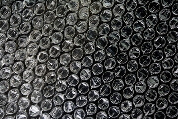 Black bubble plastic wrap surface. plastic with air balls on the surface used to pack glassware or...