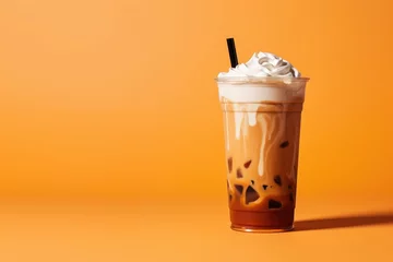 Foto auf Acrylglas Höhenskala Delicious Iced Cold Brew Coffee with Pumpkin Spice Isolated on a Orange Background
