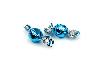 blue wrapped candies isolated on white.