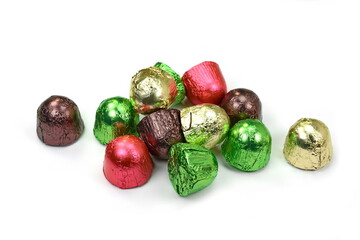 Chocolates in a multi-colored foil isolated on white background