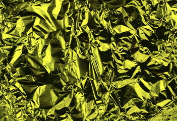Aluminum foil background with shiny crumpled surface for texture background