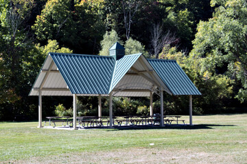 A metal roof gazebo in park.