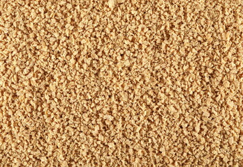 Soy flakes, soybean cereal background and texture, top view