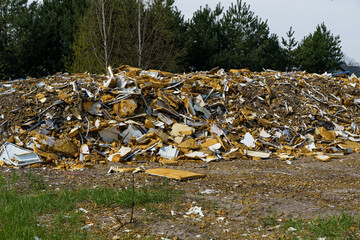 Pile of industrial synthetic waste in the forest area.