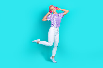 Fototapeta na wymiar Full body photo cadre of careless young girl music playlist spotify app advertisement dance rhythm isolated on aquamarine color background