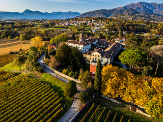 Autumnal magic and emotions on the ancient village. Between vineyards and colorful woods. Friuli. Top view - 639015197