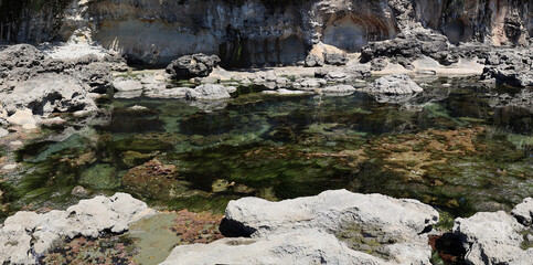Sea water pool between shore rocks