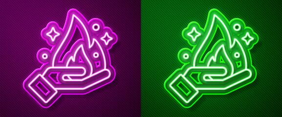 Glowing neon line Hand holding a fire icon isolated on purple and green background. Vector