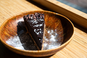Chocolate cake on a plate in a restaurant, The Netherlands