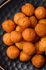 Delicious fried potato balls with breaded mozzarella, salt, spices and herbs