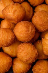 Delicious fried potato balls with breaded mozzarella, salt, spices and herbs