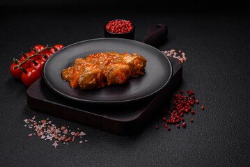 Delicious fresh sea fish cut into pieces and baked in tomato sauce