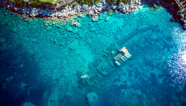 Top down aerial view of sunken ship Boka, lying on the sea bottom at the town of Orebic, Croatia, located on the Peljesac peninsula.