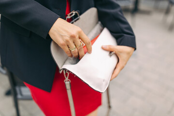 business woman holding a clutch