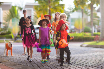 Kids trick or treat. Halloween fun for children.