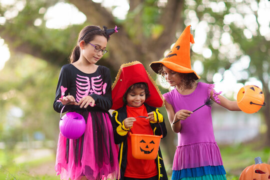 Kids trick or treat. Halloween fun for children.