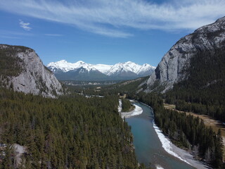 Aerial view of Banff in Canada showing unique landscape with river and mountains at distance
