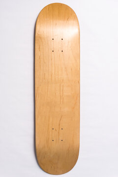Blank skateboard deck isolated on white background. Wooden board