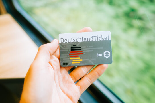 DeutchlandTicket in hands, man holding new German subscription travel card. Gelsenkirchen, Germany. August 11 2023