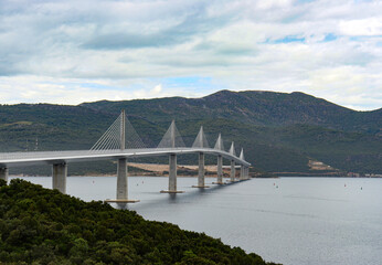 Pelješac bridge in Croatian Dalmatia coast over the adriatic sea on a cloudy day
