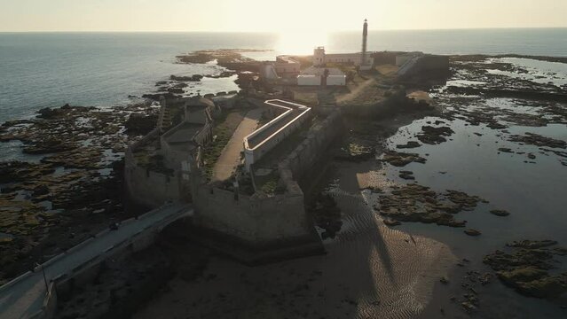 Captivating aerial footage of Avanzada de Santa Isabel at sunset, Cadiz, Andalusia province, Spain.
