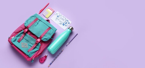 Stationery with school backpack and bottle for water on lilac background with space for text