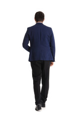 Young businessman walking away on white background, back view