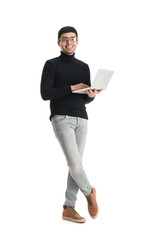 Young businessman working with laptop on white background
