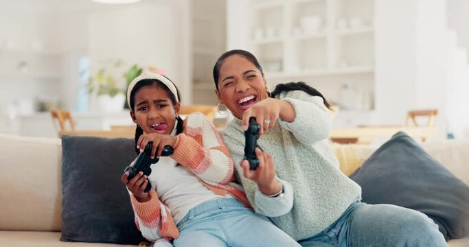 Playing video game, mother or daughter on sofa, fun or relax in home living room with internet, controller or esports. Online gaming, technology or excited girl with mom on couch on virtual challenge