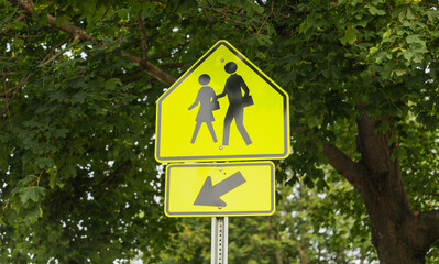 Pedestrian sign signifies safety, crosswalks, and shared public spaces, emphasizing pedestrian rights and traffic awareness