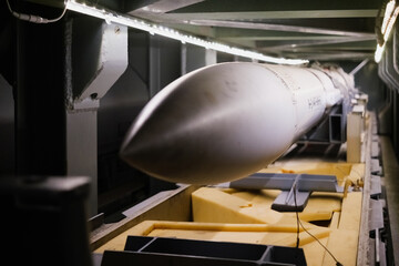 A torpedo on a submarine, underwater weapon.