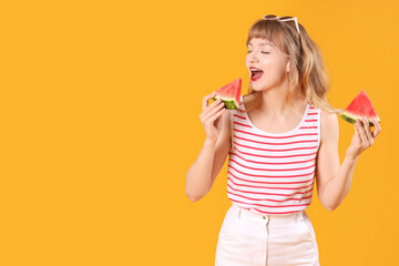 Young woman with slices of fresh watermelon on orange background