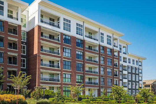 Brand New Apartment Building On Summer. Canadian Modern Residential Architecture. Modern Complex Of Apartment Buildings