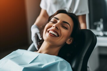 selective focus of smiling young woman in dental chair with closed eyes